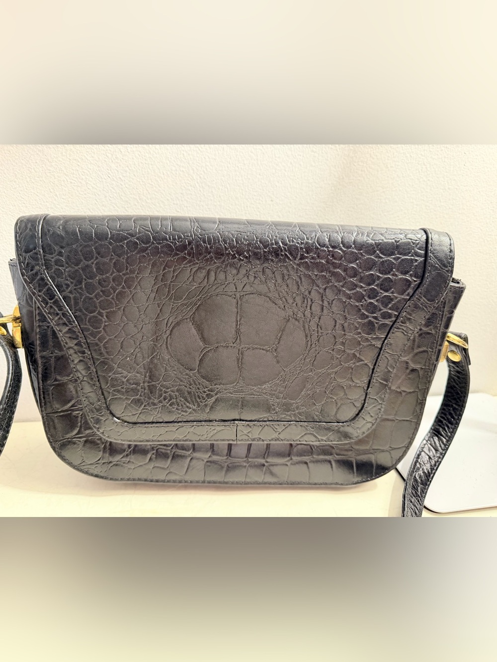 Tano croc embossed black leather crossbody bag.